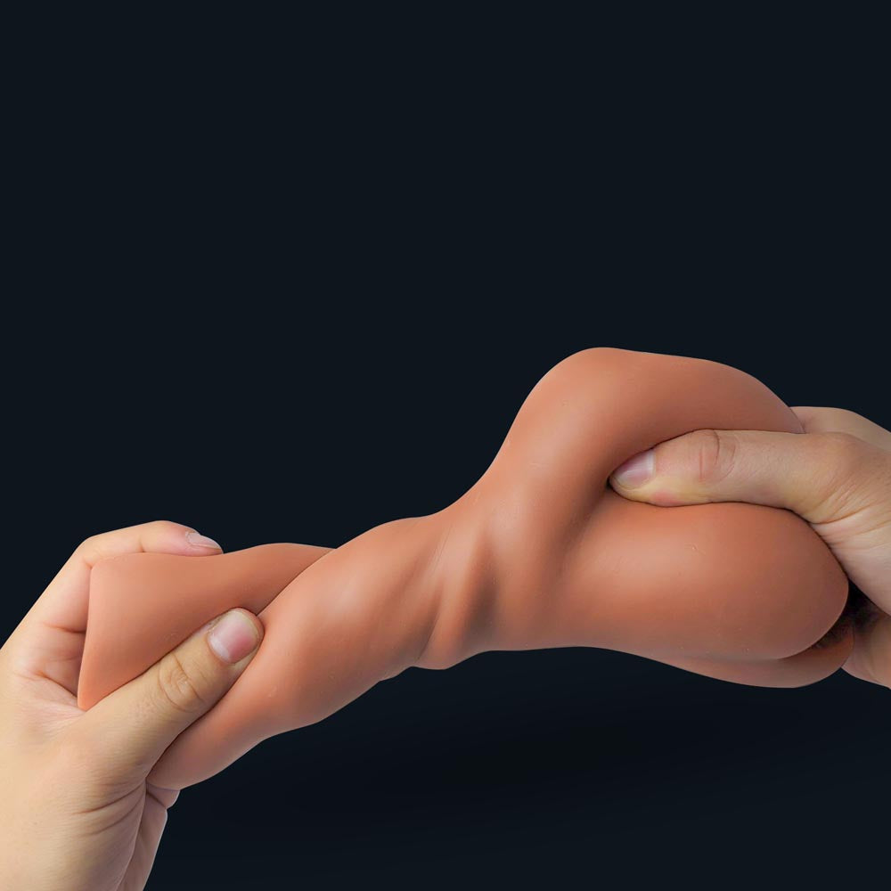 Emma pocket pussy stretched between two hands: flexible, tear-resistant material